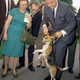LBJ picking his beagle up by the ears